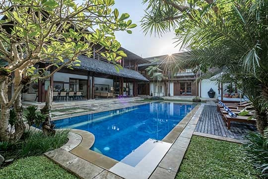 Sunkissed pool and villa